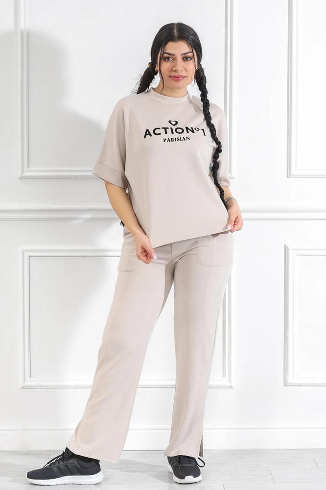 Women's casual medical tracksuit with mid-length sleeves, featuring a medium-sized letter print on the t-shirt and plain pants with a pocket and a side slit at the bottom of the pants.