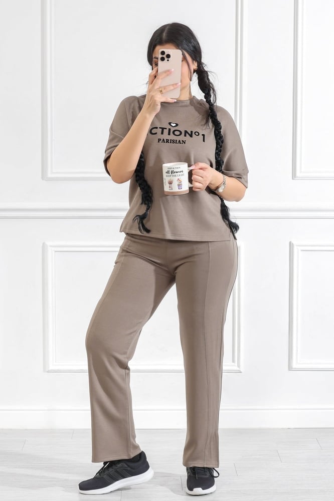 Women's casual medical tracksuit with mid-length sleeves, featuring a medium-sized letter print on the t-shirt and plain pants with a pocket and a side slit at the bottom of the pants.