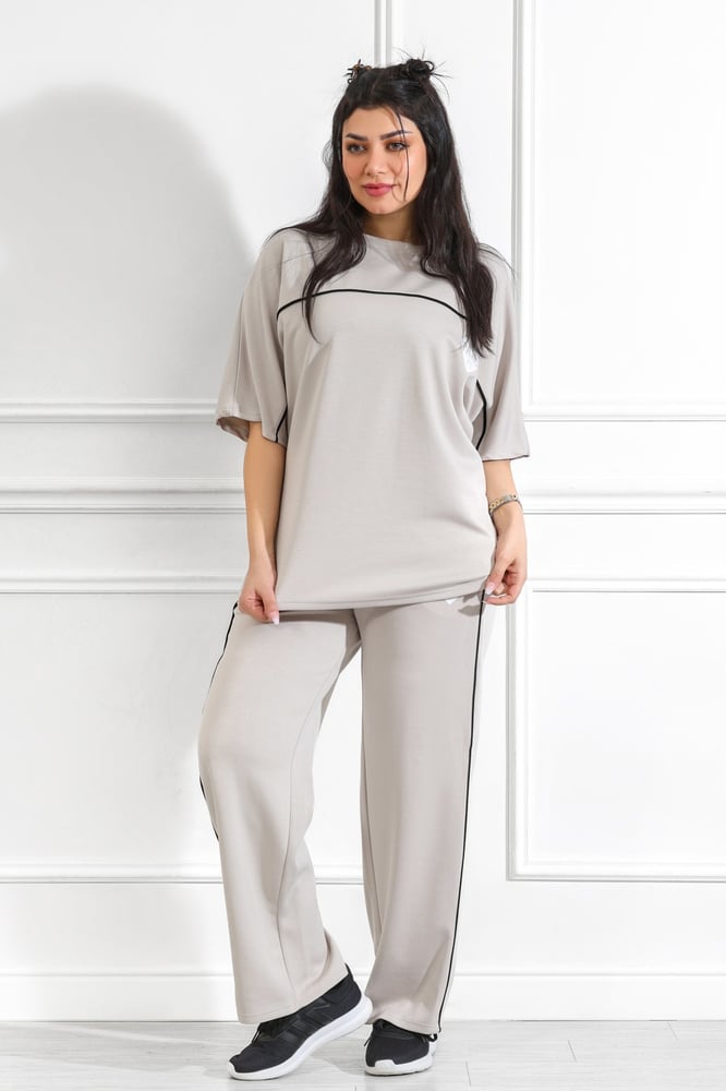 Women's casual tracksuit with mid-length sleeves, featuring a horizontal white stripe on the t-shirt and a vertical stripe on the pants.