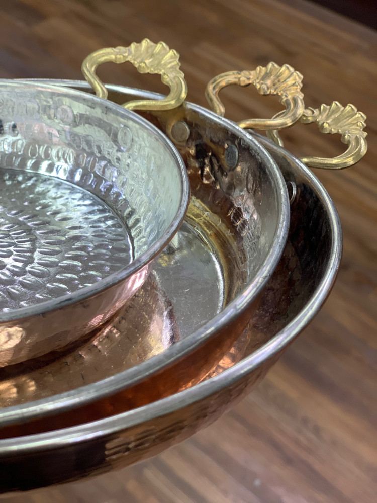A copper tray with two handles