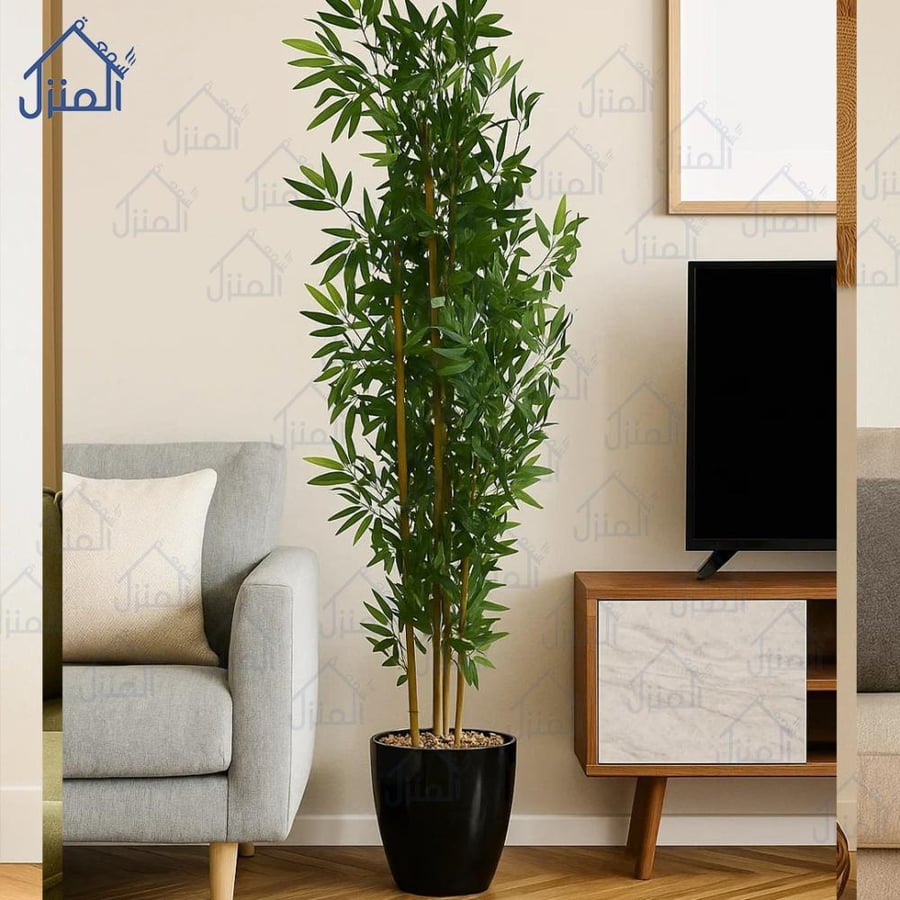 نبات صناعي مع أصيص أسود بأوراق خضراء كثيفة وتصميم طويل أنيق