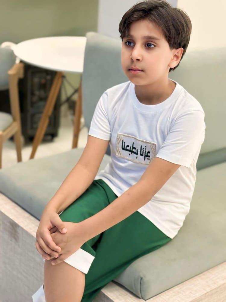تيشرت اطفال لليوم الوطني السعودي عزنا بطبعنا