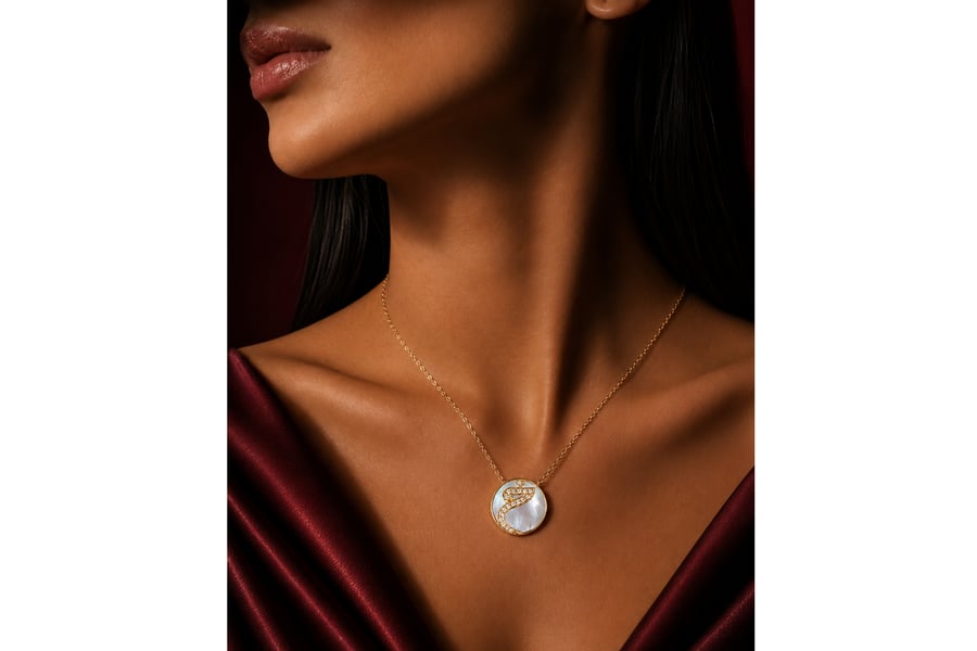 Arabic letters pendant with mother of pearl stone embedded with zircon - 18 karat.