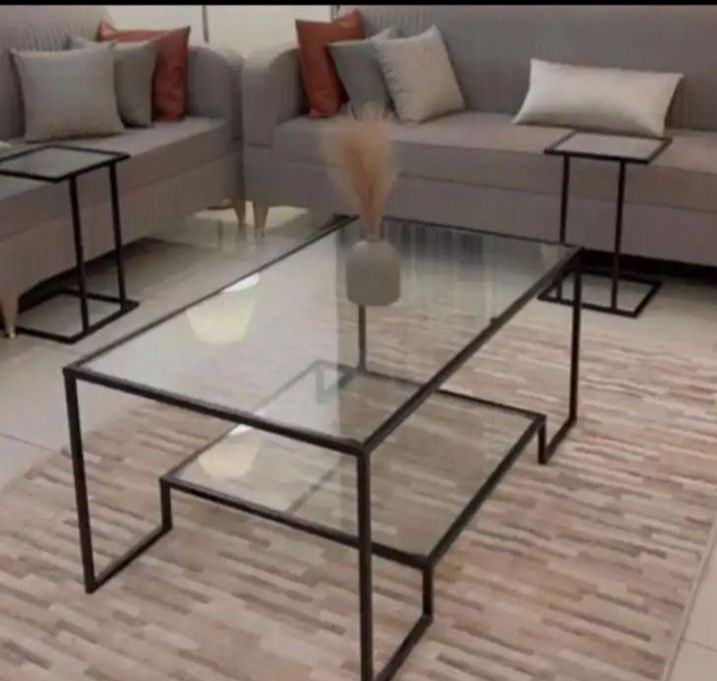 A 5-piece iron hospitality table set with glass