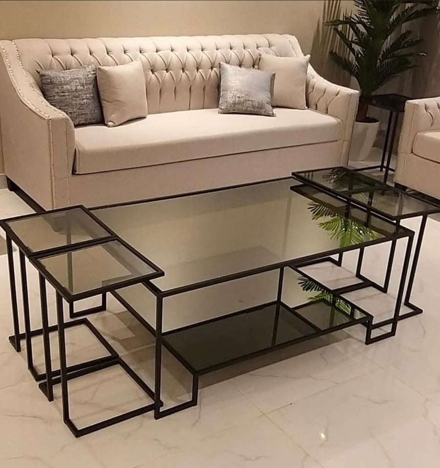 A 5-piece iron hospitality table set with glass