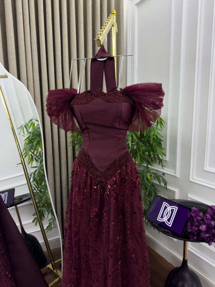Elegant evening dress with luxurious embroidery in oud color