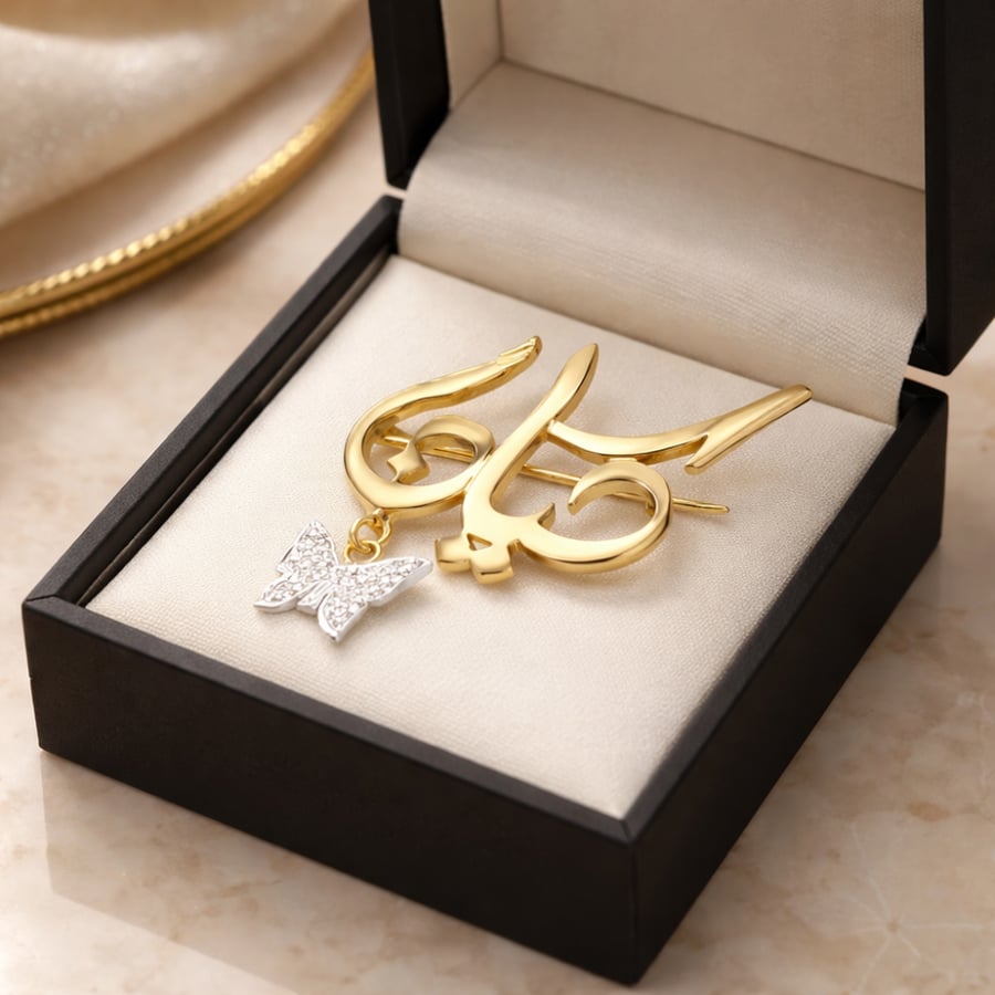 Elegant brooch plated with gold and decorated with distinctive stones