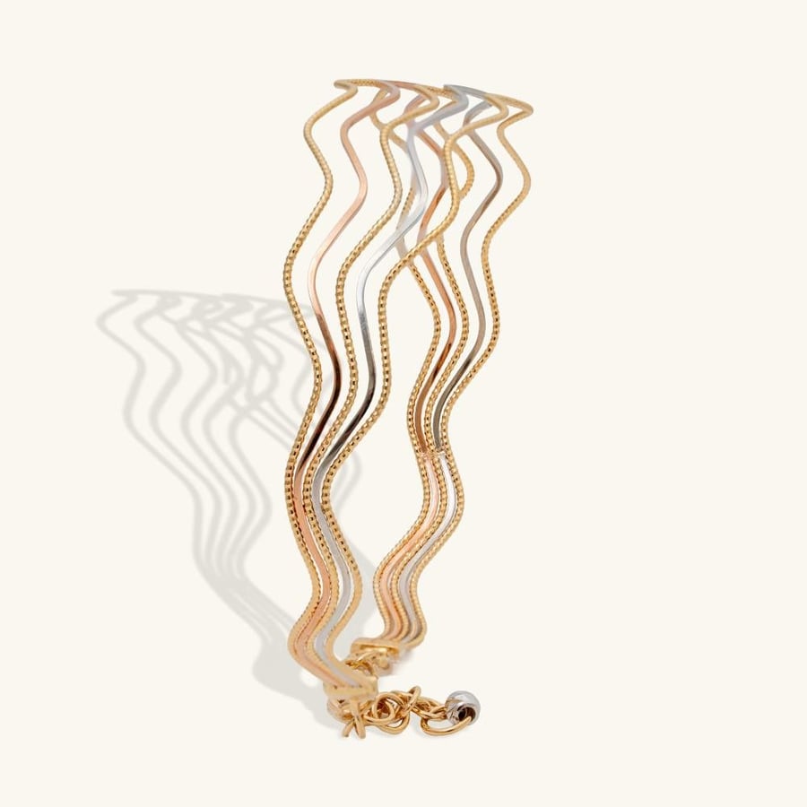 تفاصيل تصميم اسوارة ذهب أمواج ثلاثي اللون