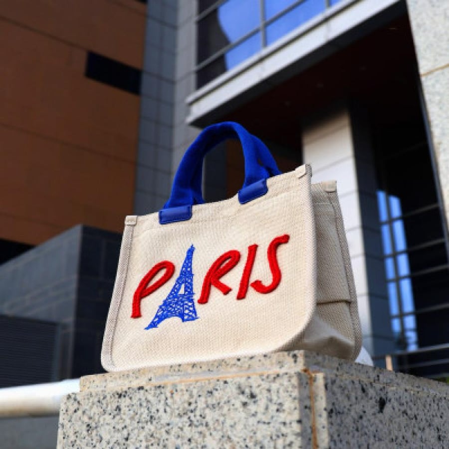 A women's bag made of fabric in beige color