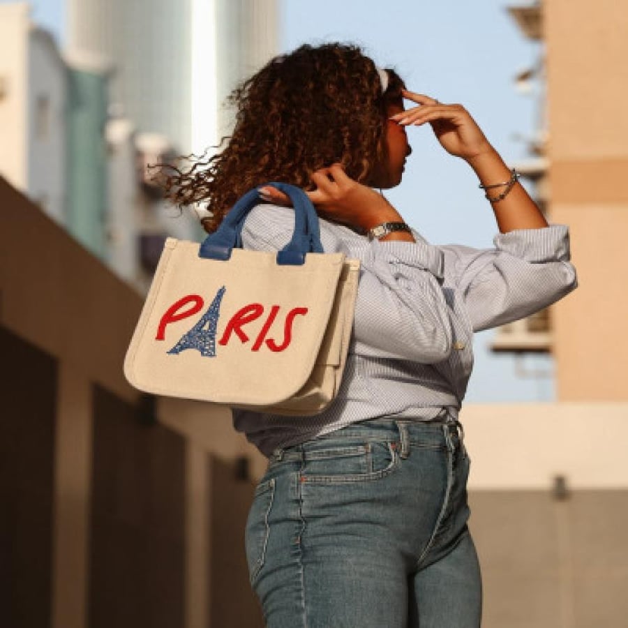 A women's bag made of fabric in beige color