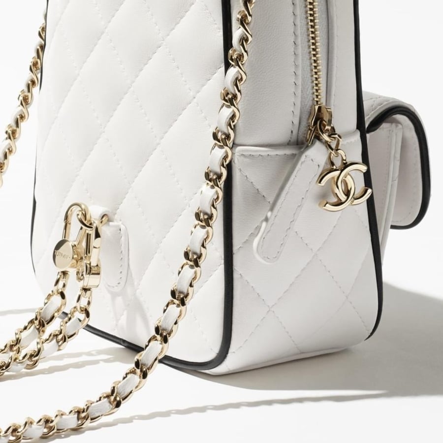 CHANEL white BACKPACK  حقيبة شانيل ظهر أبيض بإطار أسود