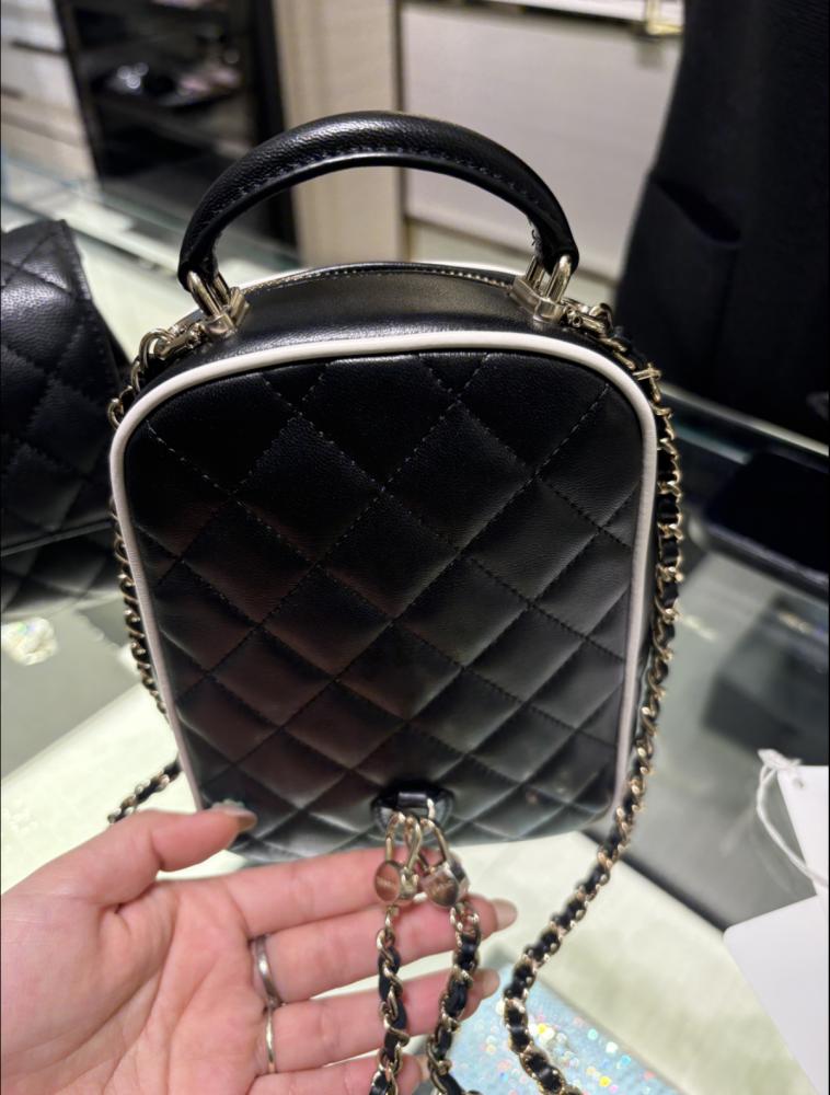 CHANEL BLACK BACKPACK  حقيبة شانيل ظهر أسود بإطار أبيض