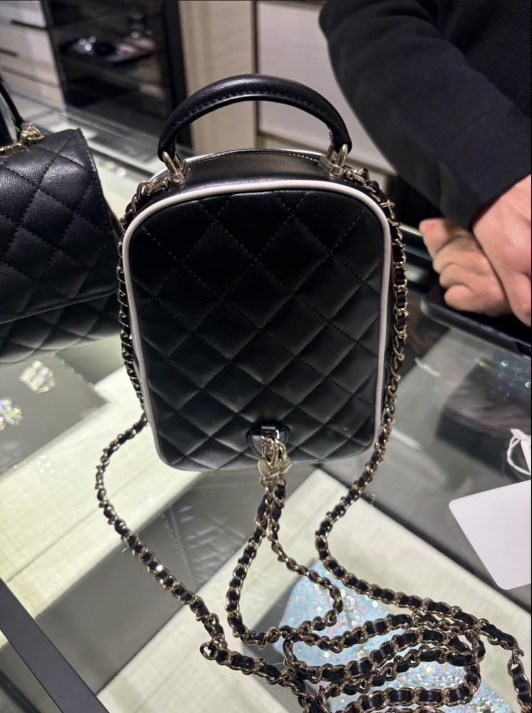 CHANEL BLACK BACKPACK  حقيبة شانيل ظهر أسود بإطار أبيض