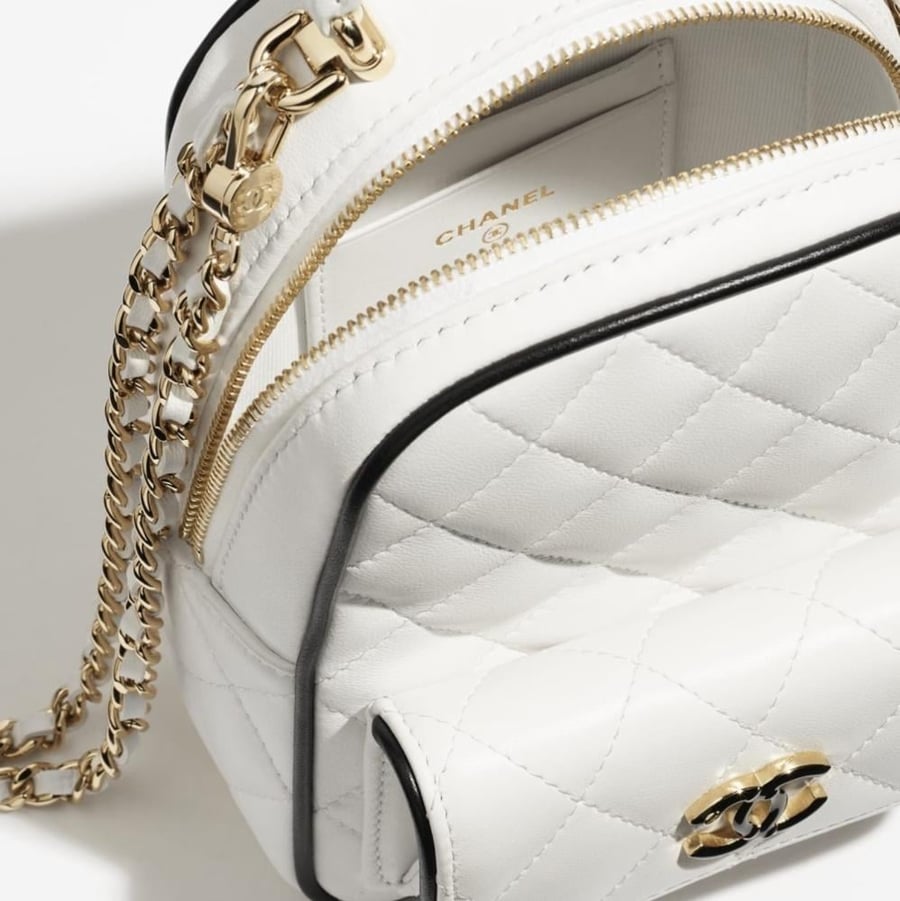 CHANEL white BACKPACK  حقيبة شانيل ظهر أبيض بإطار أسود