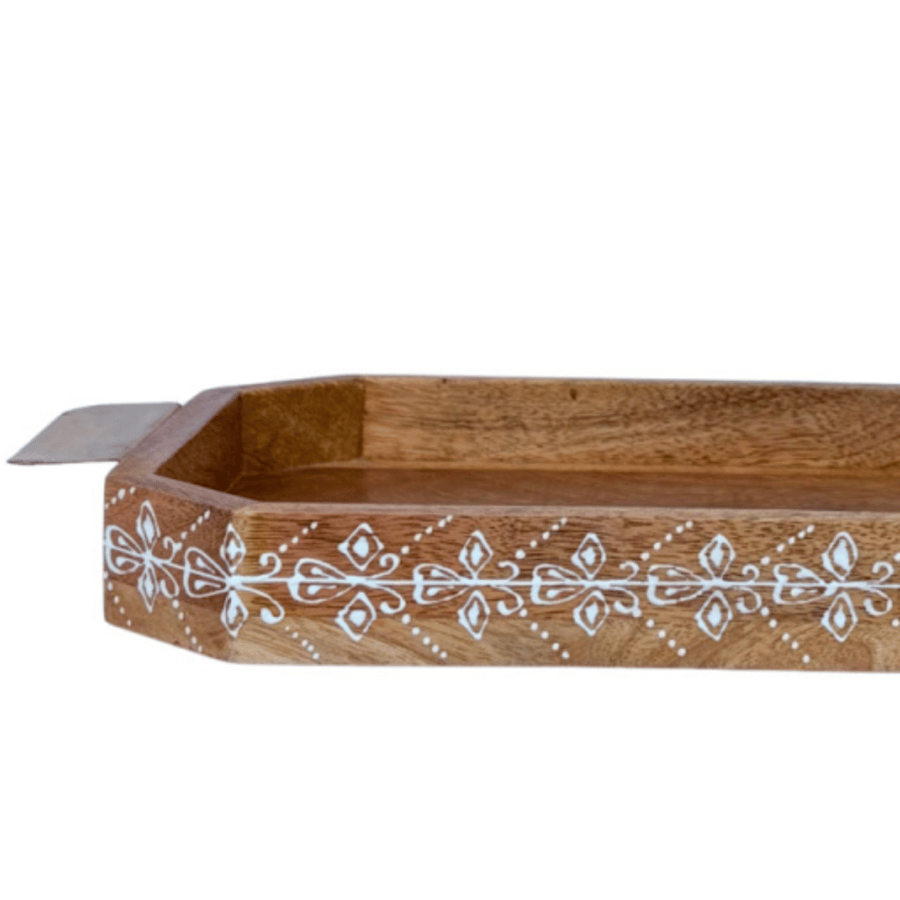 A decorated wooden serving tray with copper handles