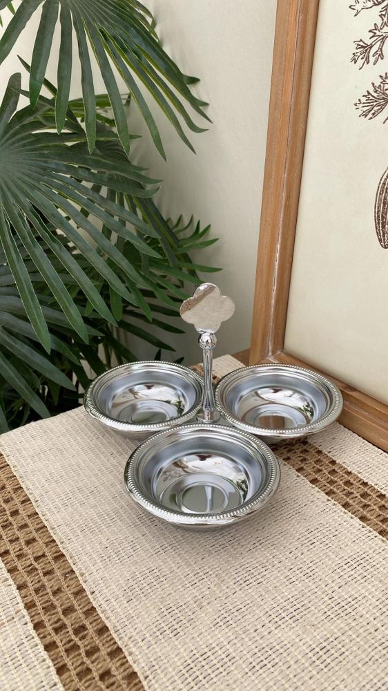 A gift of nuts with a silver three-piece steel handle