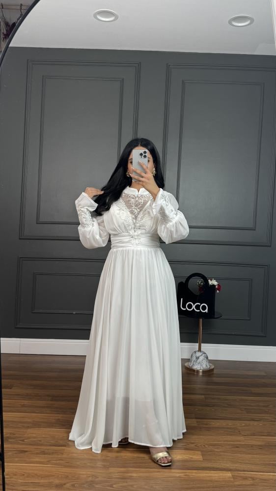 A soft fabric dress and off-white color from Luka Fashion
