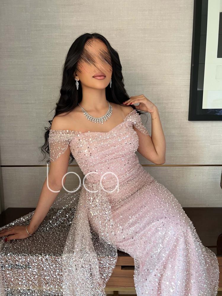 A special evening dress with shiny rhinestones in nude color