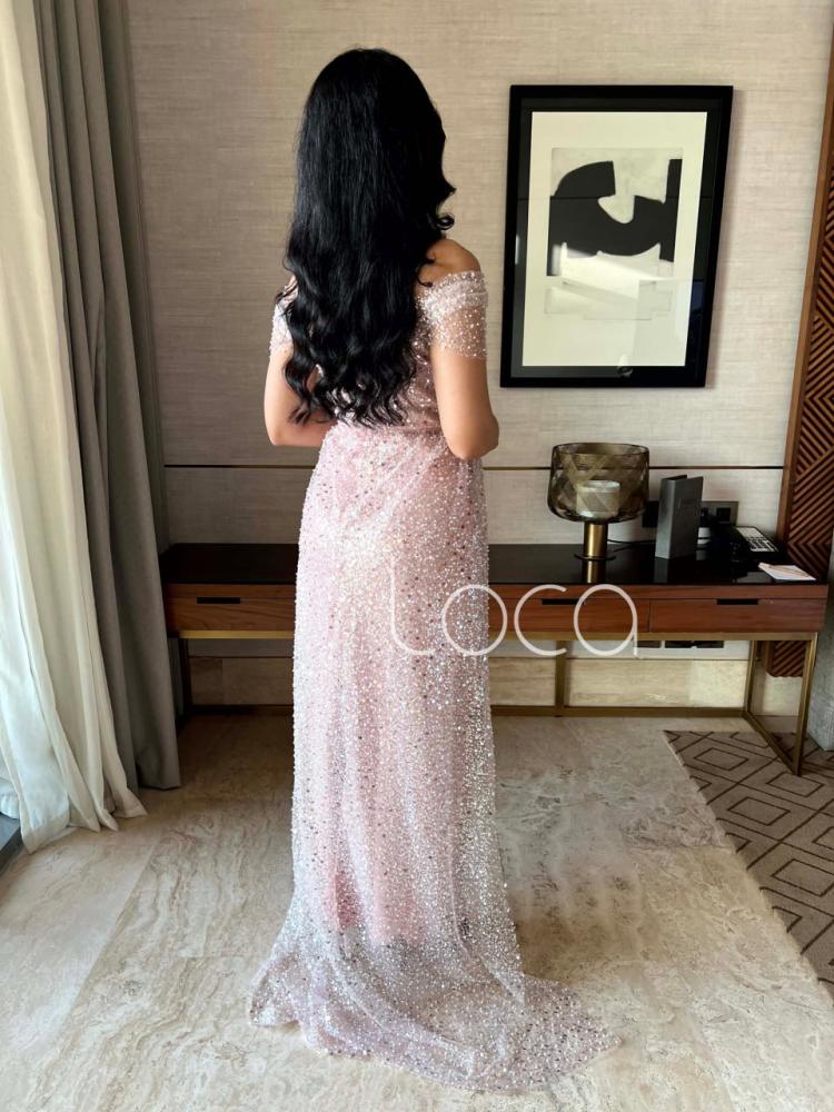 A special evening dress with shiny rhinestones in nude color