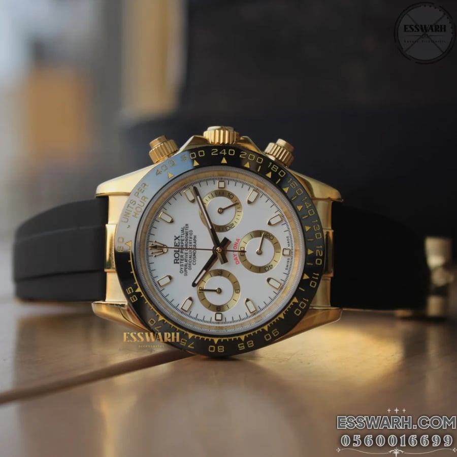 Rolex Daytona Cosmograph watch - Battery operated, rubber strap, white dial, gold bezel, seconds hand, automatic movement, size 40