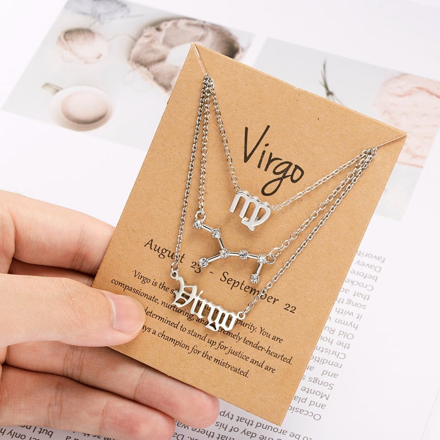 The luxurious horoscope necklace consists of three chains (the symbol, the star and the name) in gold-plated metal - choose your sign
