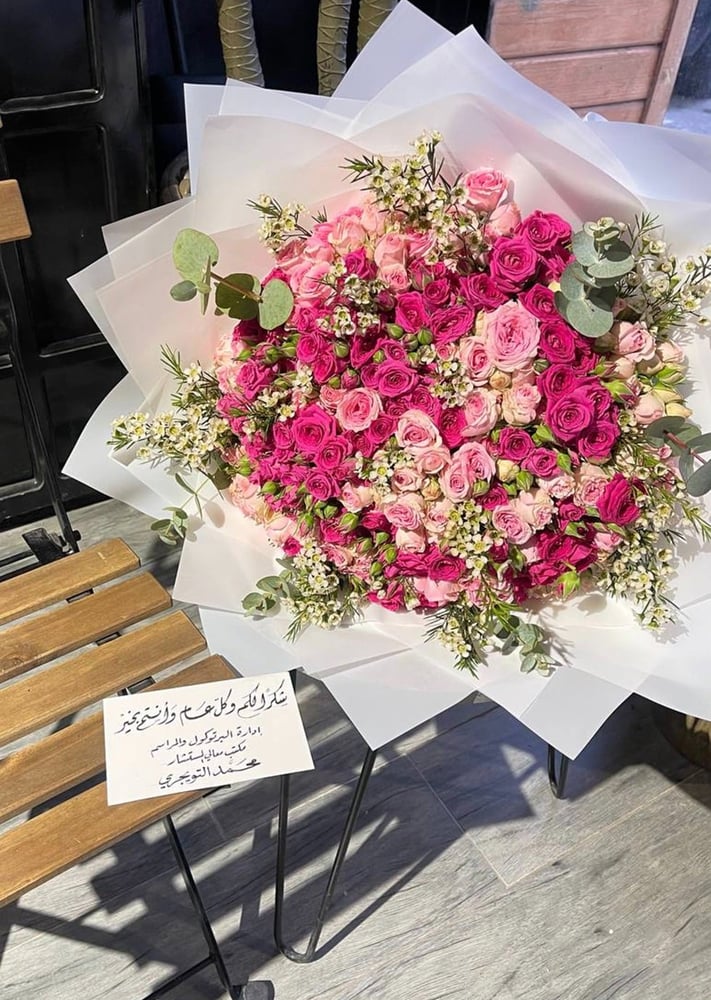 A bouquet of mixed flowers with transparent white wrapping