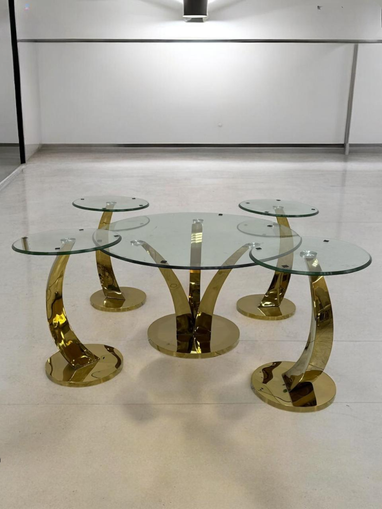 Set of stainless steel and glass service tables in various colors
