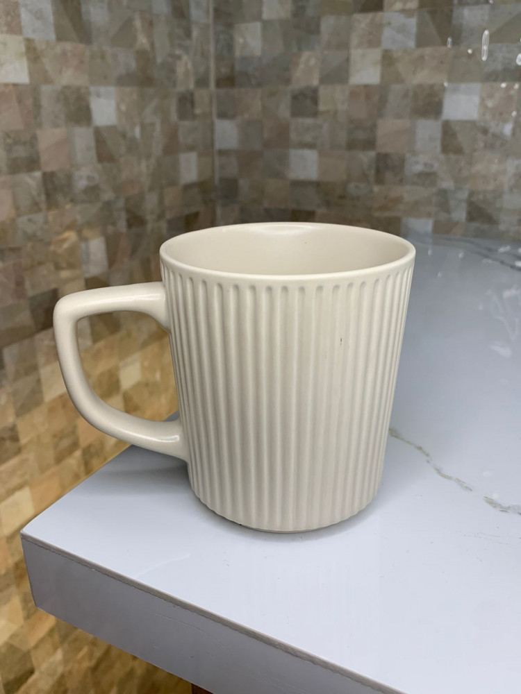 Ceramic mug with white handle