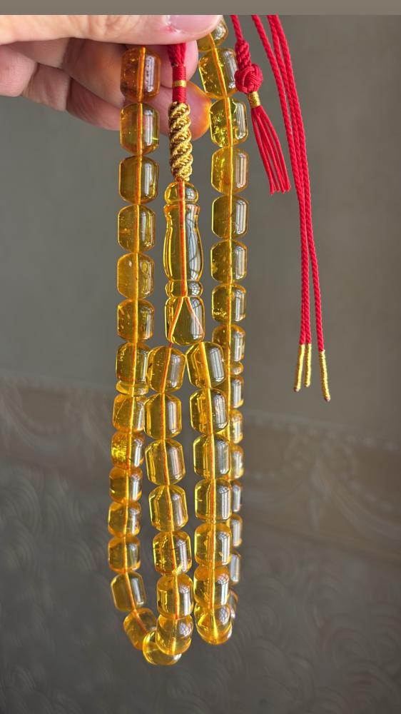 مسباح كهرمان شفاف ( شوائب خفيفه ) برميلي