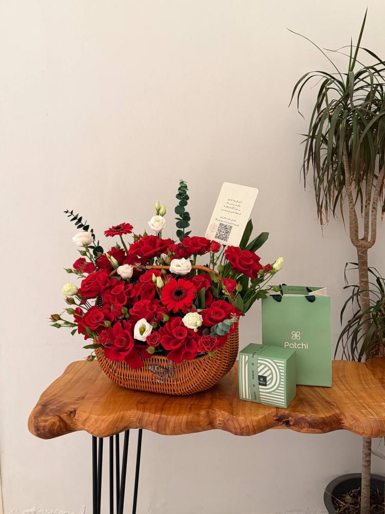 A basket of roses with a pastry