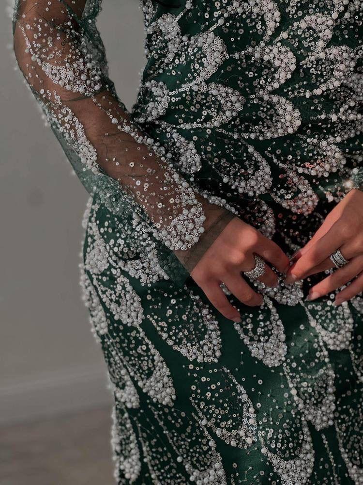 Evening dress with beads and an elegant tail