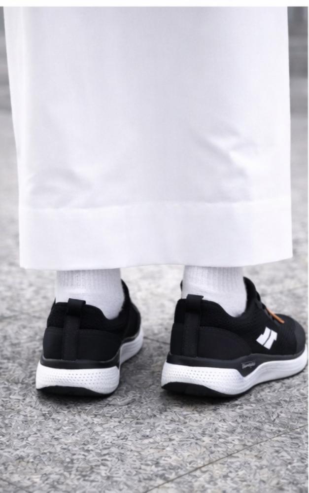 STRIKE – GLIDE casual lightweight sports shoe for running and daily walking with breathable mesh surface and comfortable sole for shock absorption and high stability throughout the day. Luxurious, modern, and elegant black color.