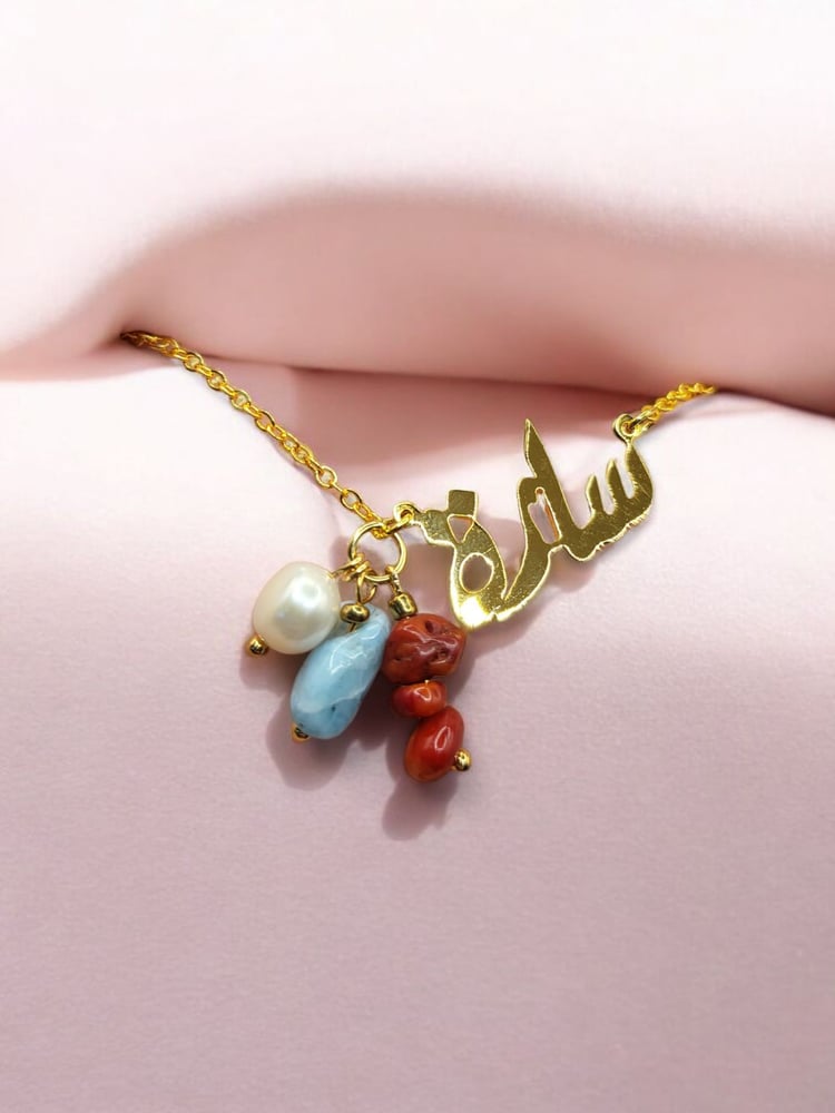 A necklace named Sarah suitable for summer and marine energy decorated with natural farmed pearl and larimar stone and natural coral