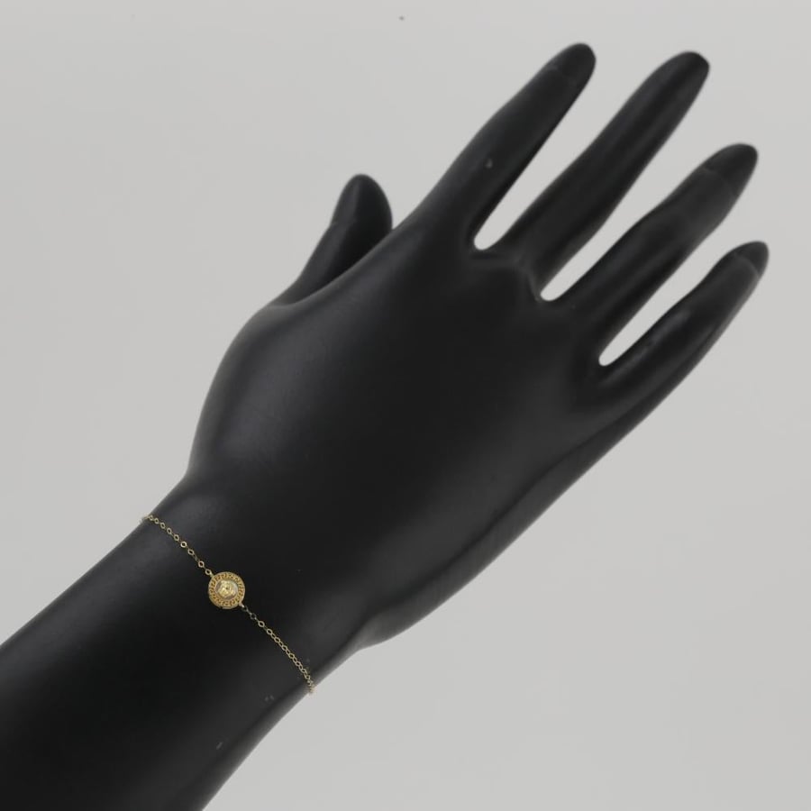 Gold circular bracelet with face engraving - 18 karat