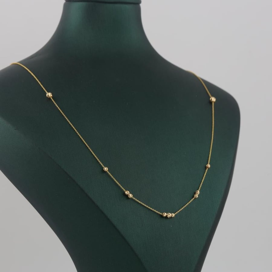 Soft gold set with laser balls - 21 karat