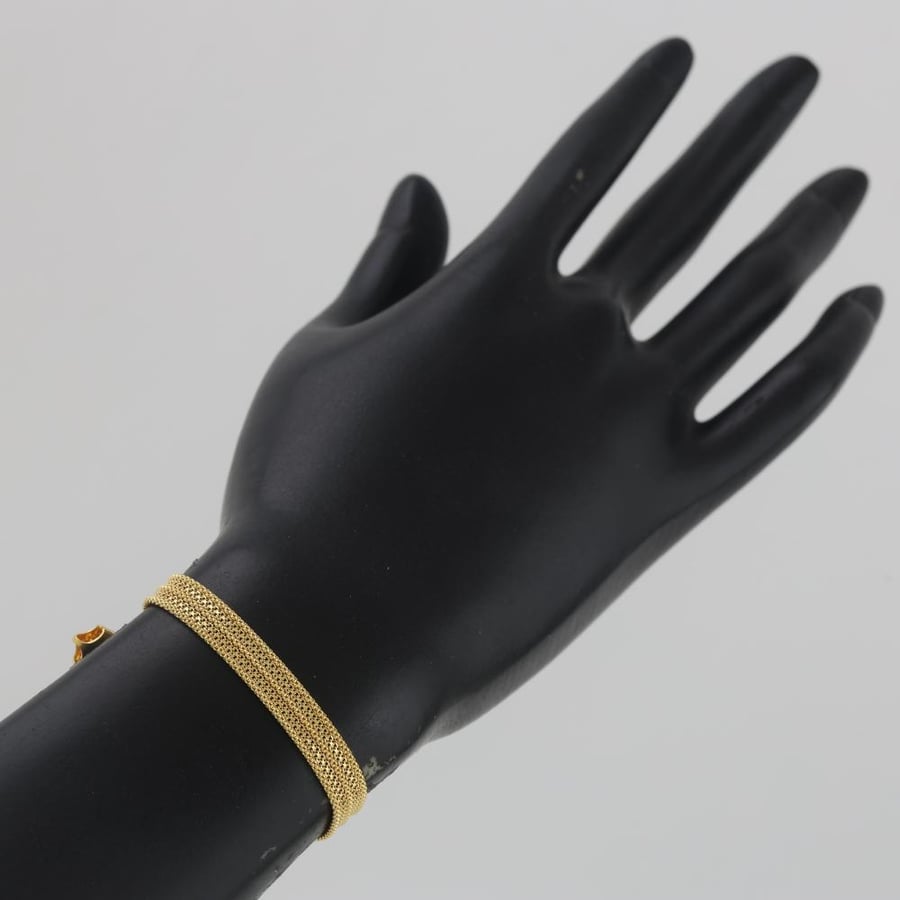 A distinctive flat gold bracelet with ball ends - 21 karat