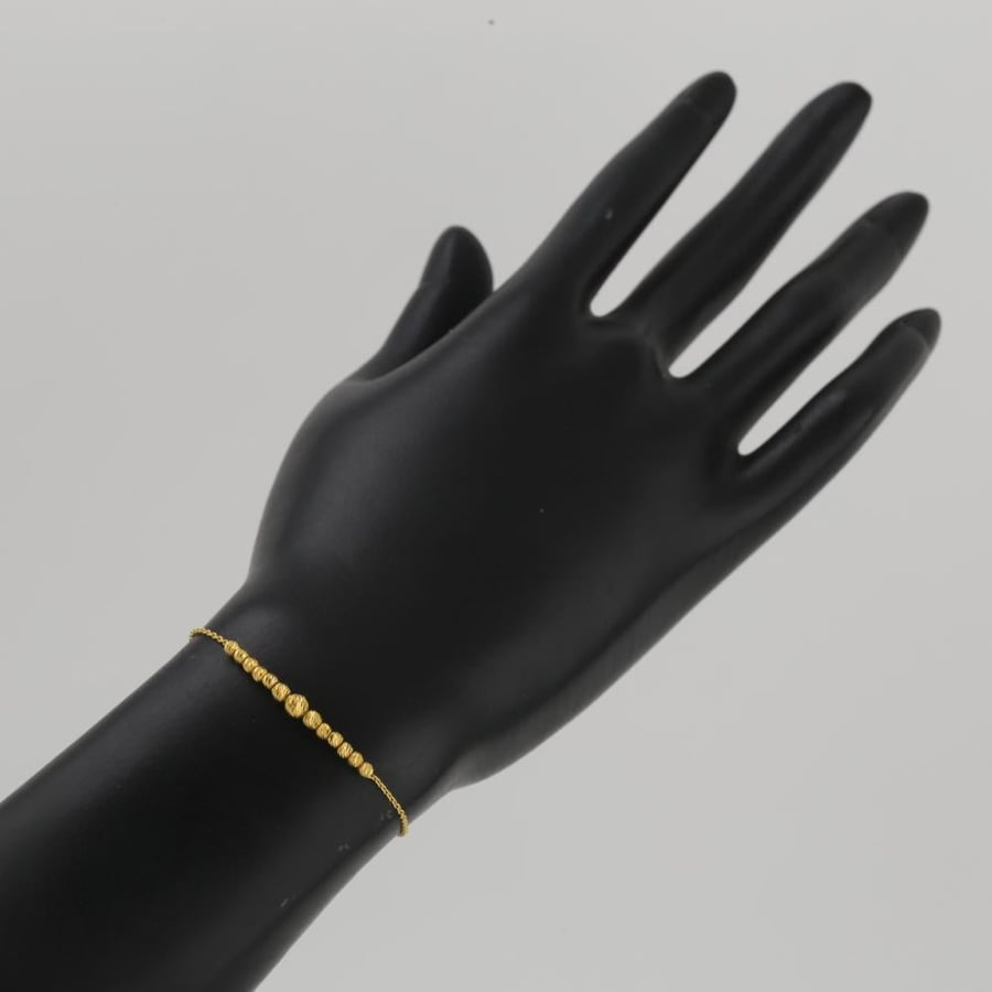 A delicate gold bracelet with laser balls - 21 karat