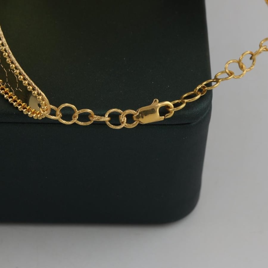 Gold bracelet and ring with honeycomb engraving - 21 karat