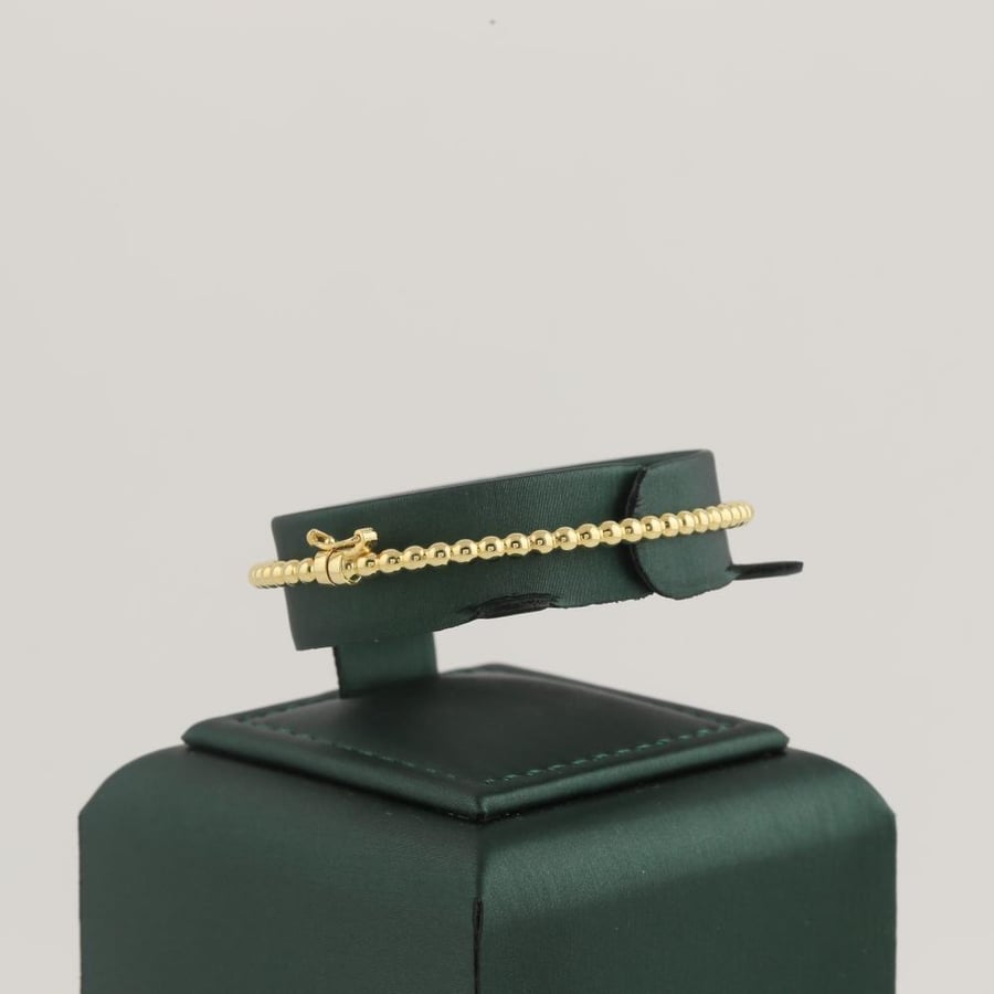 Gold bracelet with shiny gold balls - 18 karat