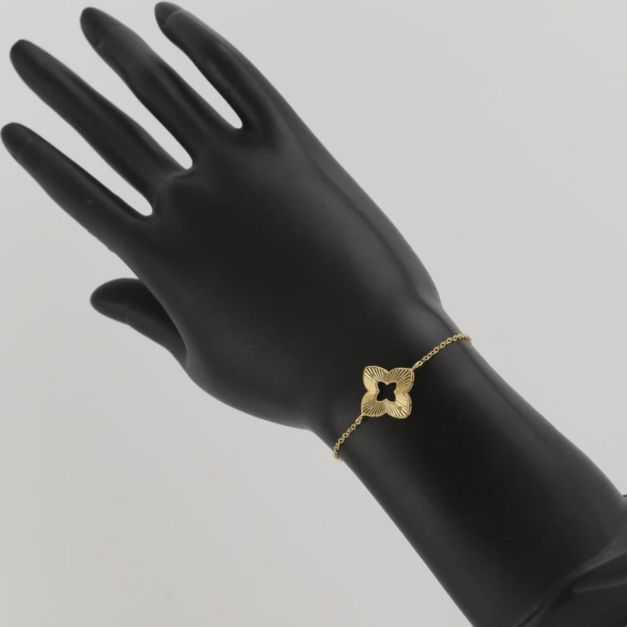 Gold bracelet with star design and sparkling stones - 18 karat