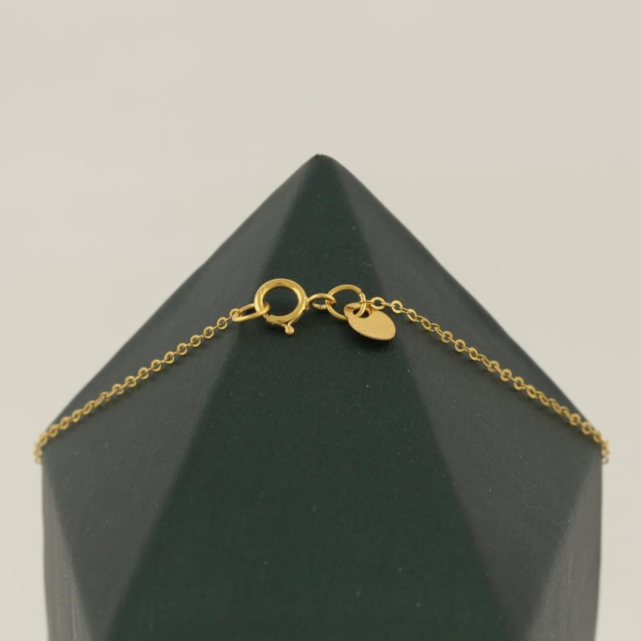 Gold hand with plant four-leaf clover - 21 karat