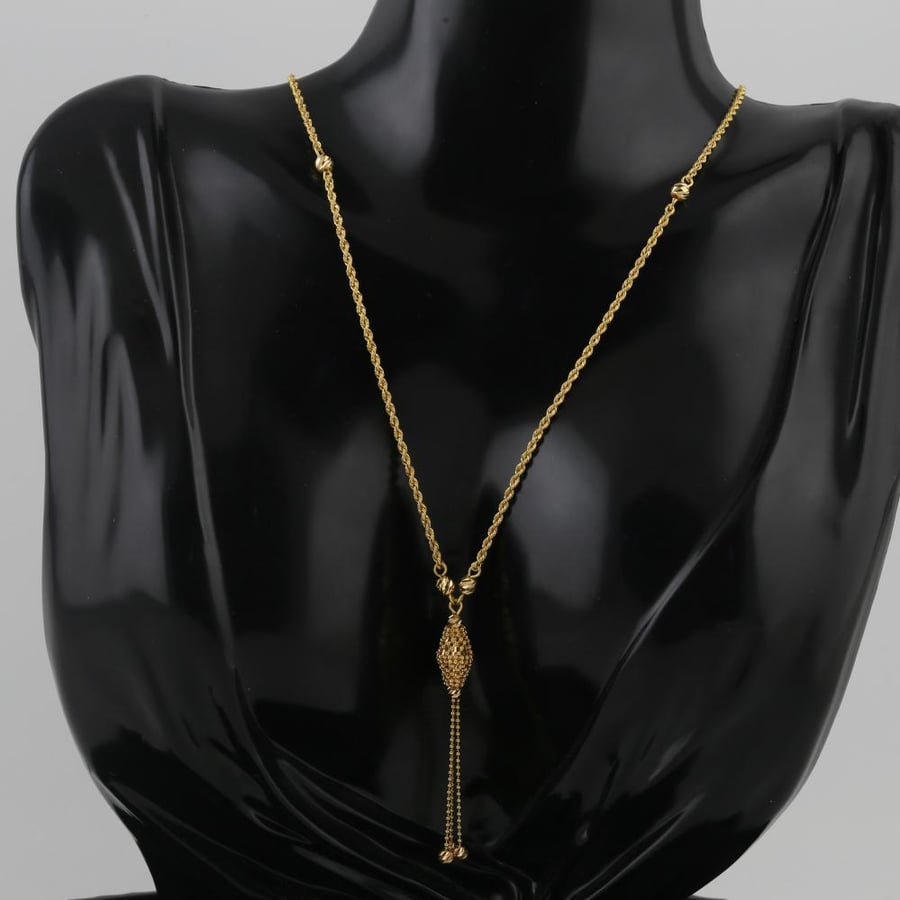 A twisted gold necklace with a specific pendant, gold balls - 21 karat