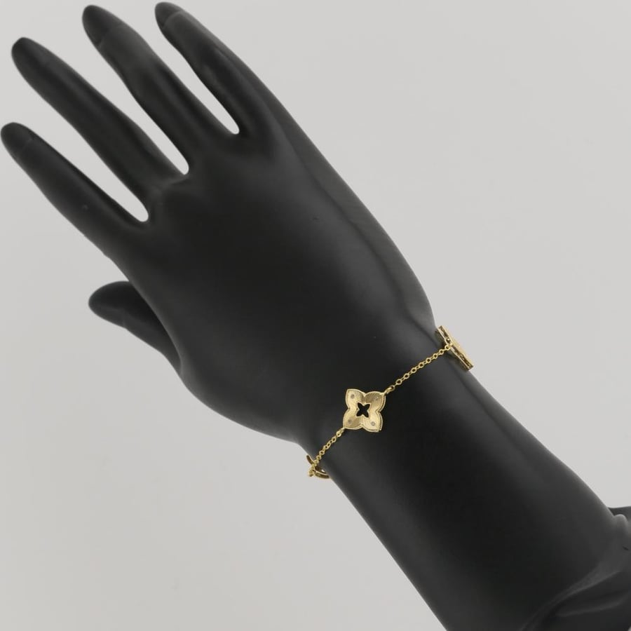 Gold bracelet with star design and sparkling stones - 18 karat