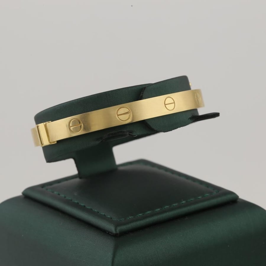 A standing gold bracelet, thin, matte, with simple engraving, 18 karat