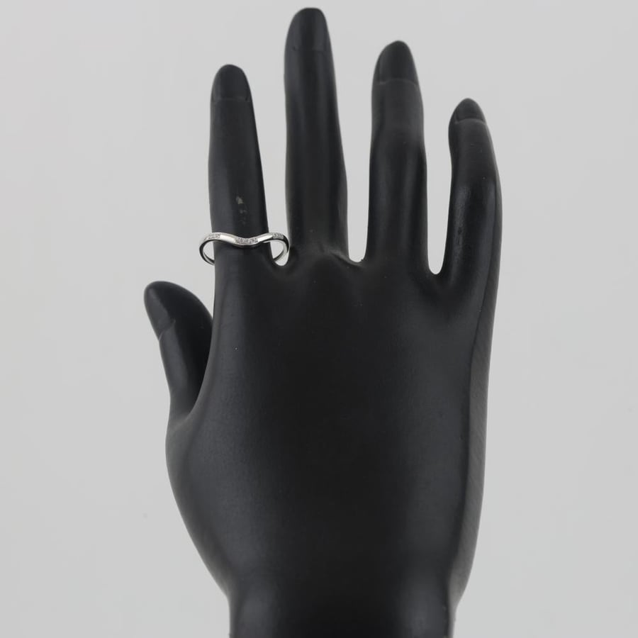 White gold ring with a soft wing design and sparkling stones - 18 karat