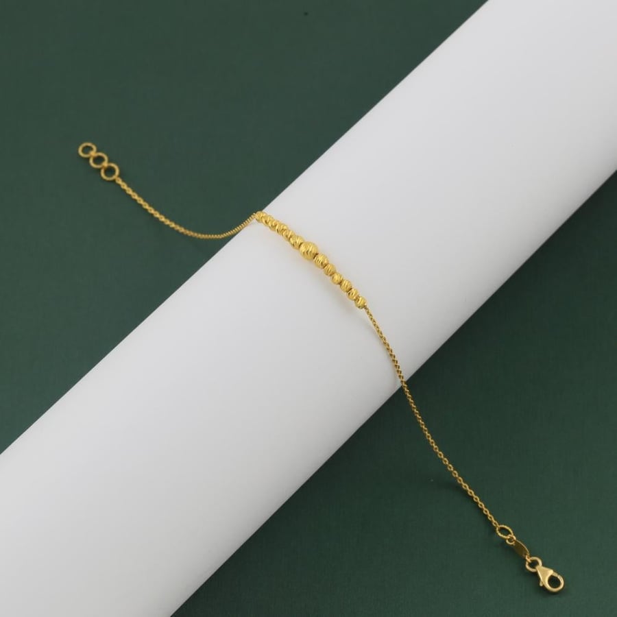 A delicate gold bracelet with laser balls - 21 karat