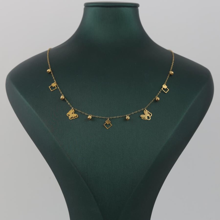 Gold charm with butterflies and a shiny eye - 18 karat