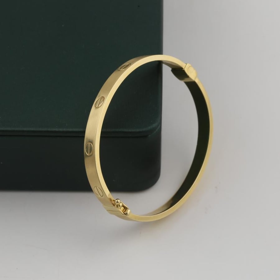 A standing gold bracelet, thin, matte, with simple engraving, 18 karat