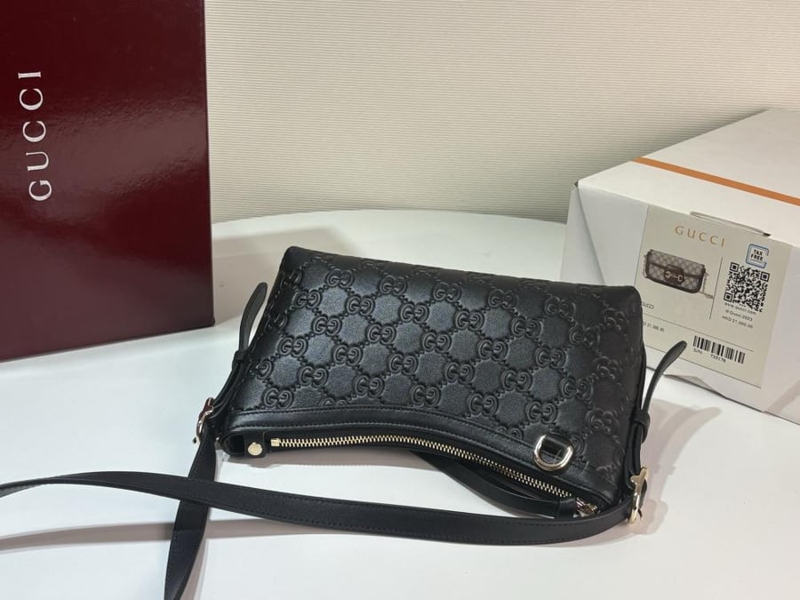 Gucci GG Embossed Leather Shoulder Bag – Black