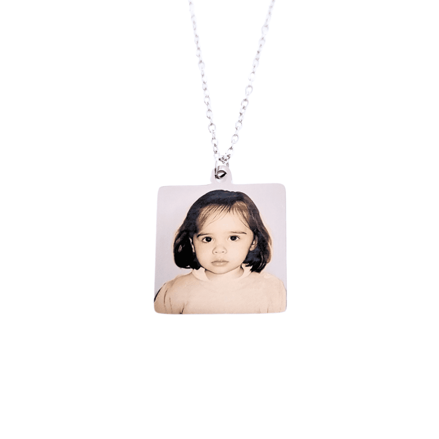 Carving of a picture on a square pendant - silver